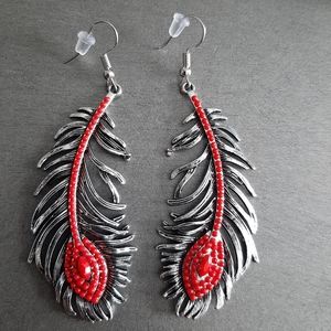 Red tail feather tribal earrings